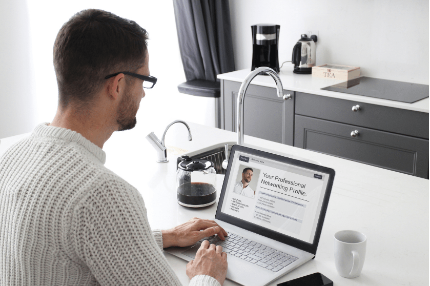 man at computer creating a social profile